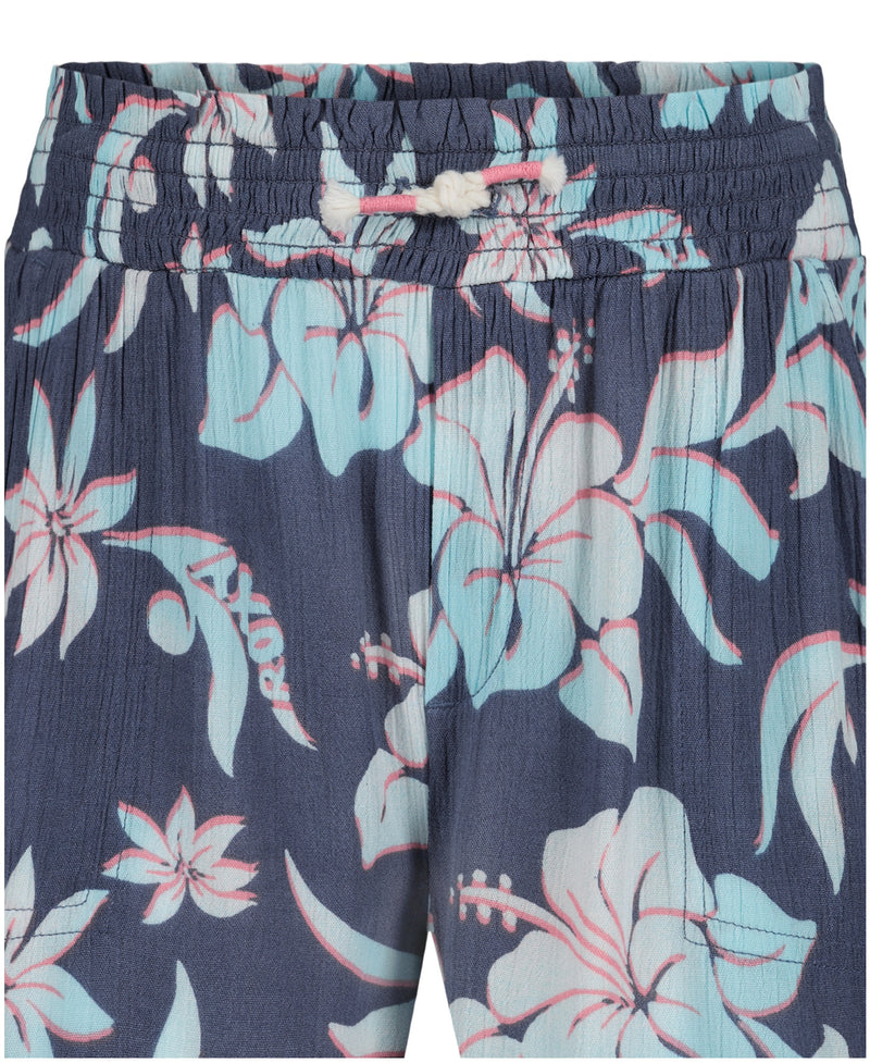 Close-up of the waistband and upper section of Roxy Girls' Hula Soleil Short in navy, featuring a pastel blue and pink hibiscus print, elastic waistband, and knotted front drawstring—perfect tropical shorts for sunny days.
