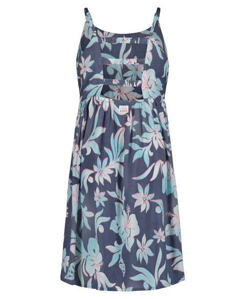 The Girls' Hibiscus Hype Dress by Roxy is a sleeveless, knee-length fit and flare dress with thin straps, a gathered waist, cutout bodice, and features a blue background with light pink and white tropical floral print.