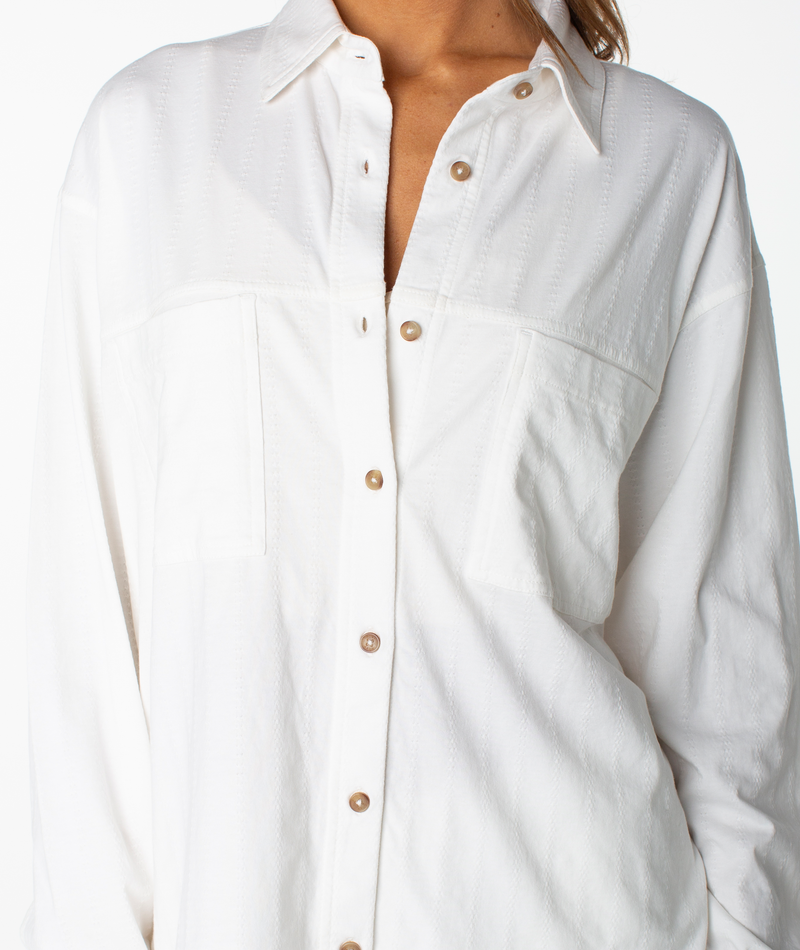 Roxy Sandpiper Button Up: white long-sleeved shirt with two chest pockets and a textured vertical-stripe pattern.