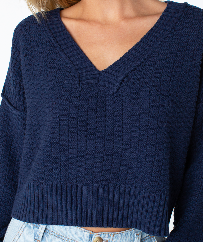 Navy blue Study Hall Sweater in a cozy textured V-neck knit with a ribbed hem.