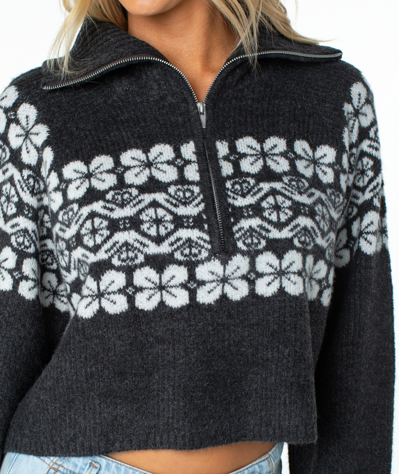 Roxy Cedar Grove Sweater in charcoal grey, featuring a cropped quarter-zip design with a white floral and geometric chest pattern in a relaxed fit.