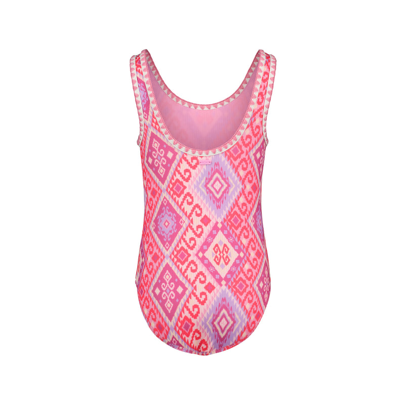 The Roxy Girls' La Palma One Piece swimsuit features wide shoulder straps and a pink, red, and lavender geometric diamond and swirl pattern on a white background, shown on a plain white surface.