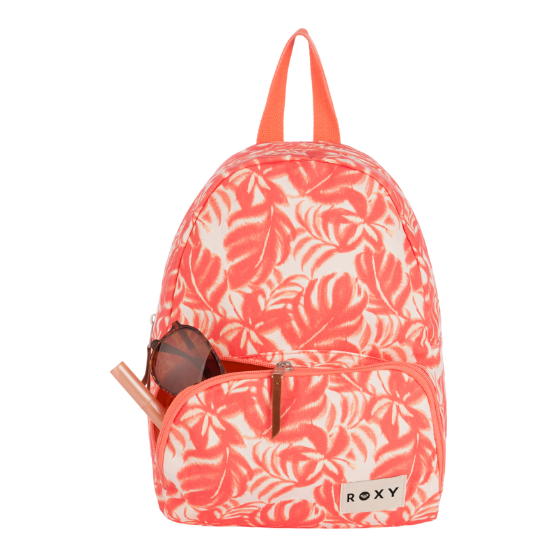 A coral and white tropical leaf-print Roxy Always Core Canvas Backpack rests against a plain white background. This stylish women’s backpack features a small front pocket containing brown sunglasses and a straw, and is finished with a convenient top handle.