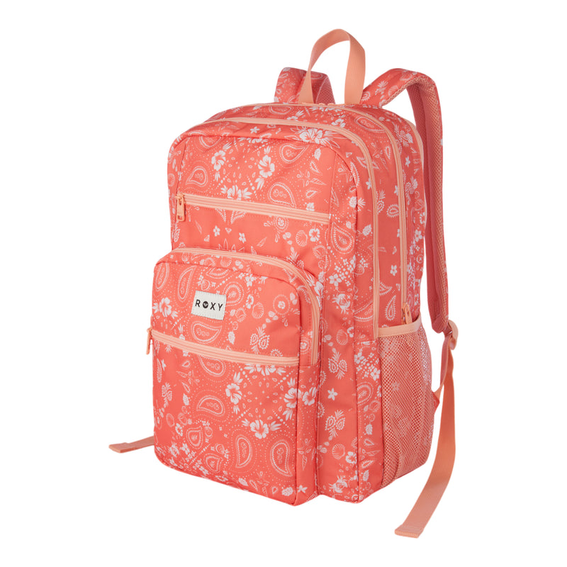 The Roxy Campus Crush Backpack in coral pink, featuring a white floral and paisley print, includes two front zippered organizer pockets, a side mesh pocket, a padded laptop sleeve, and adjustable padded straps. The backpack is displayed standing upright against a white background.