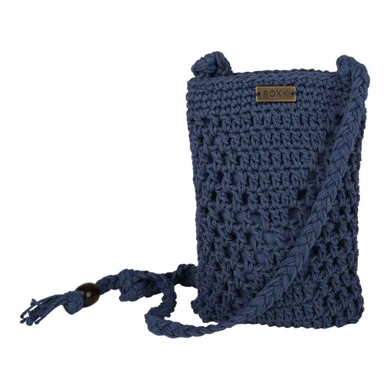 The Roxy Chips And Guac Phone Bag is a small, navy blue crochet crossbody featuring a braided strap, wooden bead accents, and a metal ROXY logo plate on the front. This stylish accessory showcases a textured, handmade look that enhances its unique charm.