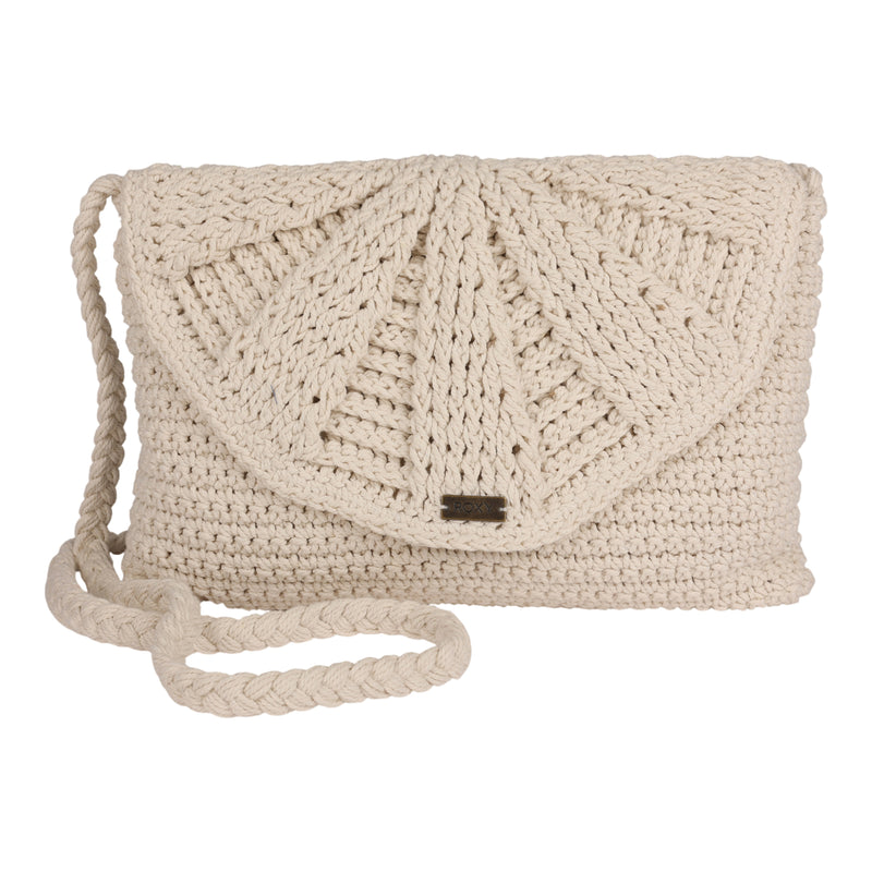 The Roxy Chips And Guac Medium Crossbody Bag is a beige crocheted shoulder bag with a flap closure, showcasing a fan-like textured pattern and a braided strap. Designed for hands-free convenience as an everyday essential, it is displayed against a white background.