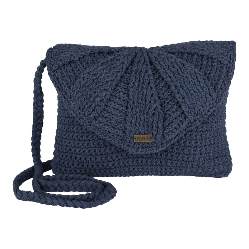 The Chips And Guac Medium Crossbody Bag by Roxy is a dark blue, knitted crossbody featuring a textured, fan-shaped flap and a thick braided strap. Designed for everyday use, this hands-free accessory is finished with a small metal Roxy tag on the front.