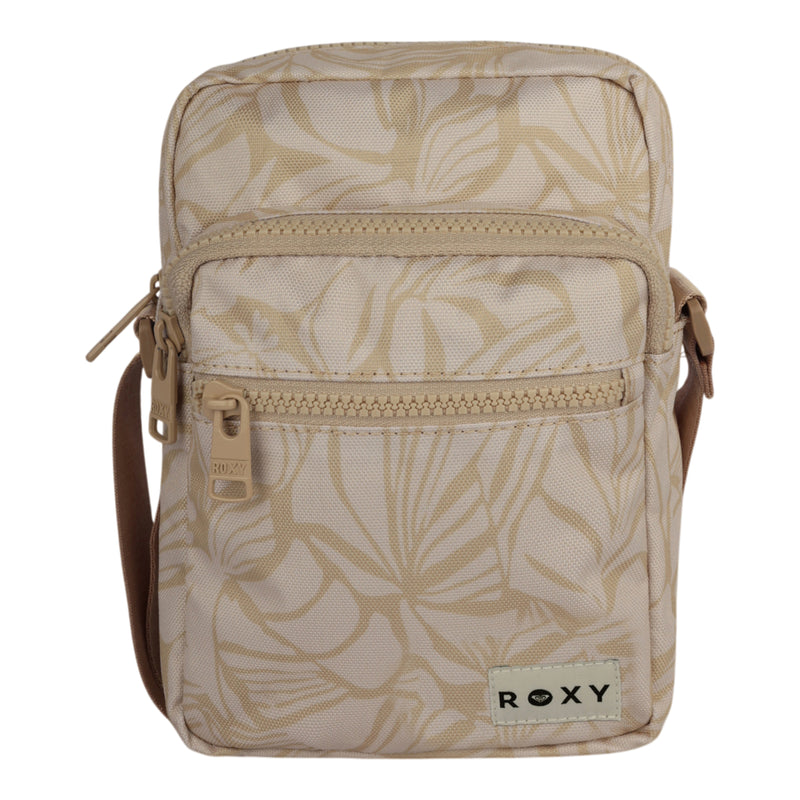 The ROXY Current Mood Crossbody Bag features a beige hue with an eye-catching leaf pattern, two zippered compartments on the front, and a small ROXY label at the bottom. It comes with a matching beige adjustable strap for comfortable wear.