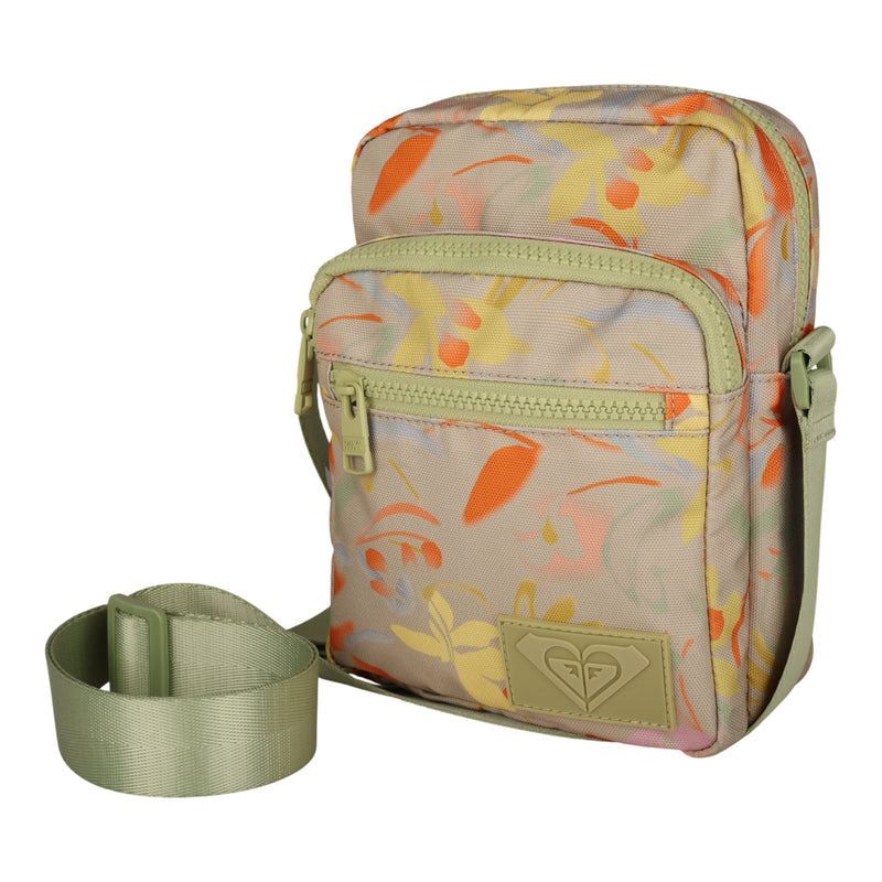 The Roxy Current Mood Crossbody Bag features a small floral pattern with pastel tones, two zippered compartments, and an adjustable olive-green strap placed beside the bag—making it a charming adventure companion perfect for any outing.