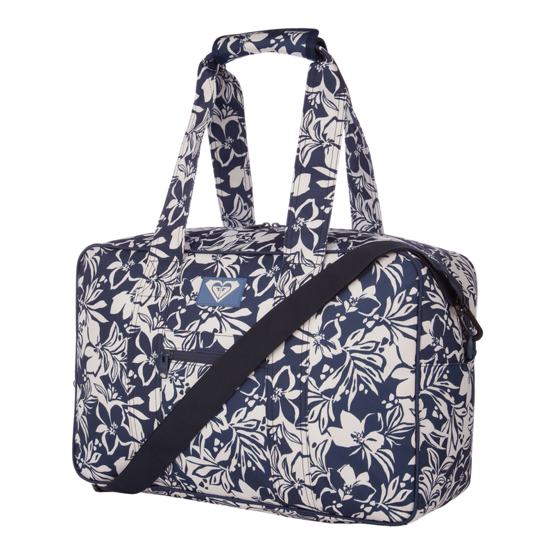 The Roxy Off Shore Duffel Bag, featuring a blue and white floral pattern, includes two handles and a detachable shoulder strap. It is displayed against a plain white background.