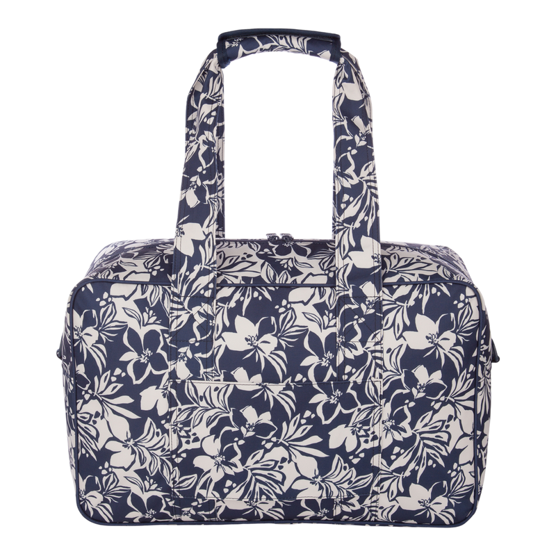 The Roxy Off Shore Duffel Bag features a rectangular shape, two sturdy handles, and a stylish navy blue and white floral pattern. Displayed against a plain white background, this versatile duffel is perfect for all your adventures.