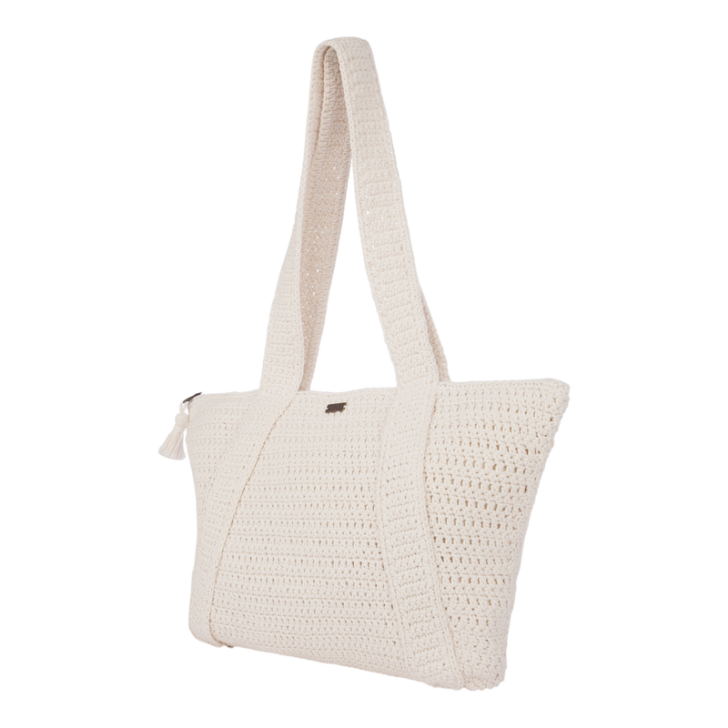 Introducing the Chips And Guac Tote Bag by Roxy: a cream-colored crochet shoulder tote featuring wide straps and a zippered top—spacious, stylish, and perfect for travel, shown against a white background.