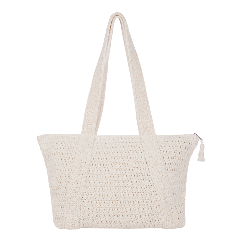 Introducing the Roxy Chips And Guac Tote Bag: a cream-colored crocheted tote with two wide shoulder straps and a secure zippered top closure, accented by a small tassel on the zipper pull. Displayed against a white background, this spacious bag is the perfect travel companion for your everyday adventures.