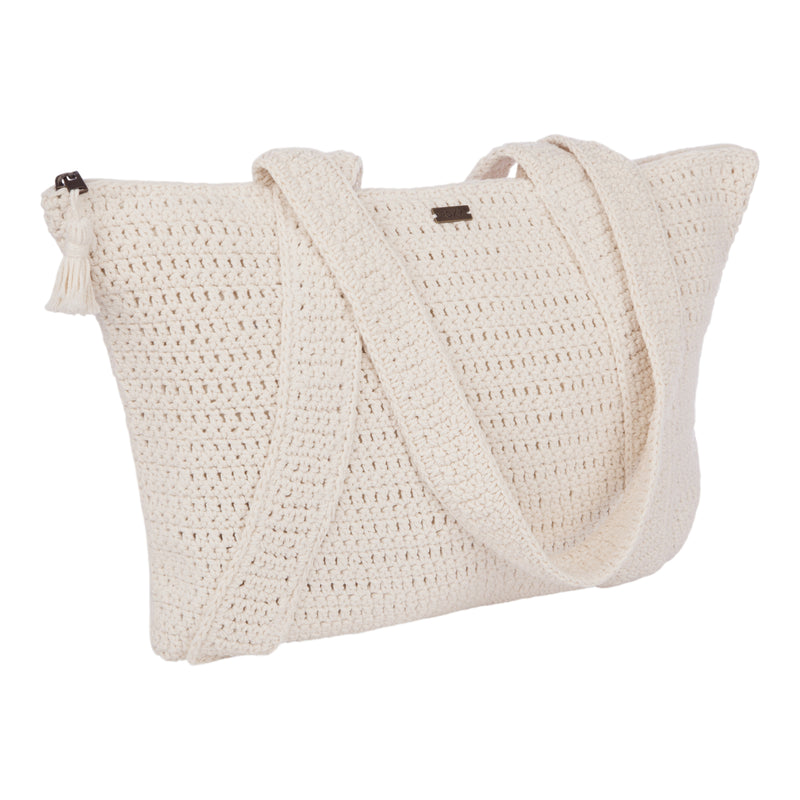 The Roxy Chips And Guac Tote Bag is a cream-colored, rectangular crochet shoulder bag featuring a tassel on the zippered top and a wide strap, shown against a white background—a perfectly spacious tote for your next travel companion.
