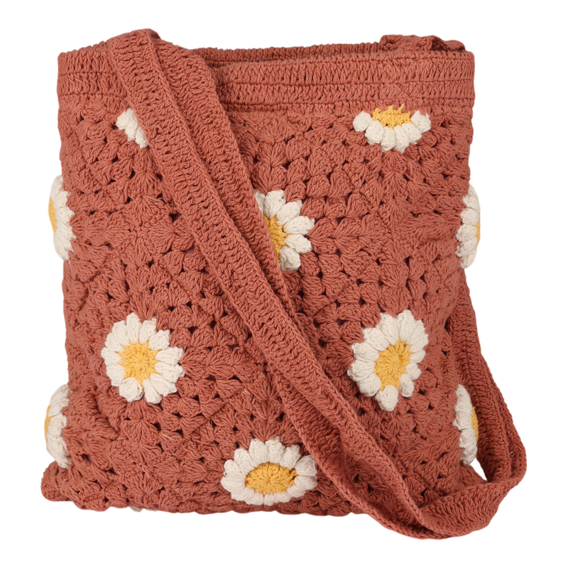 The Roxy Wandering Beach Crochet Tote Bag is a rust-colored accessory adorned with white and yellow daisy patterns and comes with a matching wide strap, shown against a white background.