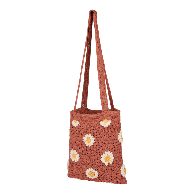 The Roxy Wandering Beach Crochet Tote Bag in Canyon Rose features white and yellow daisy patterns and two long handles, making it a perfect casual shoulder bag for everyday use, shown against a plain white background.