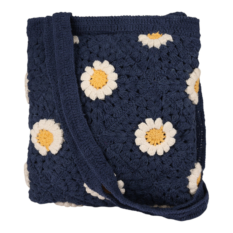 The Roxy Wandering Beach Crochet Tote Bag features a navy blue design adorned with white and yellow daisy flowers, making it the perfect lightweight accessory for sunny outings.