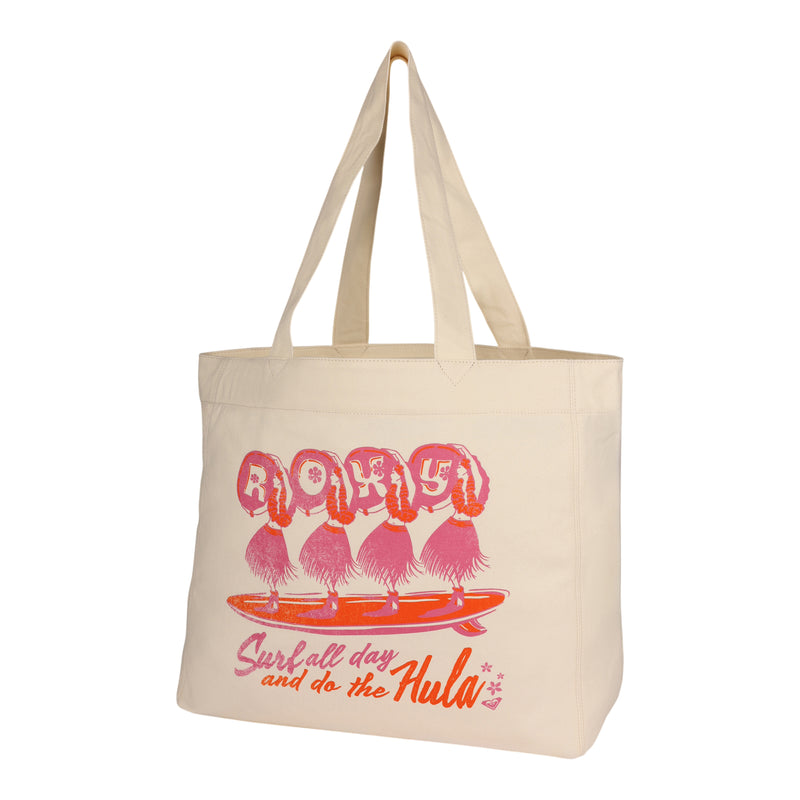 Introducing the Surf All Day Tote Bag by ROXY—a beige recycled cotton tote featuring pink and orange graphics of hula dancers on a surfboard, “ROXY” branding, the phrase “Surfall day and do the Hula,” and small star accents printed on the front.