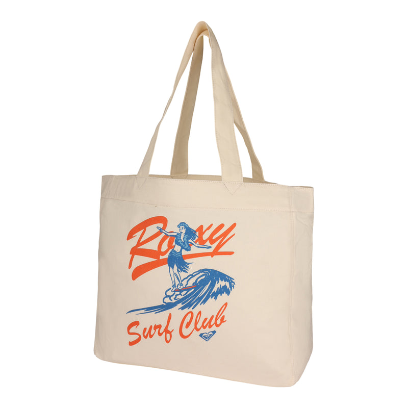Introducing the ROXY Surf Club Tote Bag—a beige canvas tote featuring a vibrant illustration of a woman surfing on a blue wave, with "Roxy Surf Club" displayed in bold red and blue text on the front. This eco-friendly tote is perfect for carrying your essentials in style while supporting sustainable fashion.