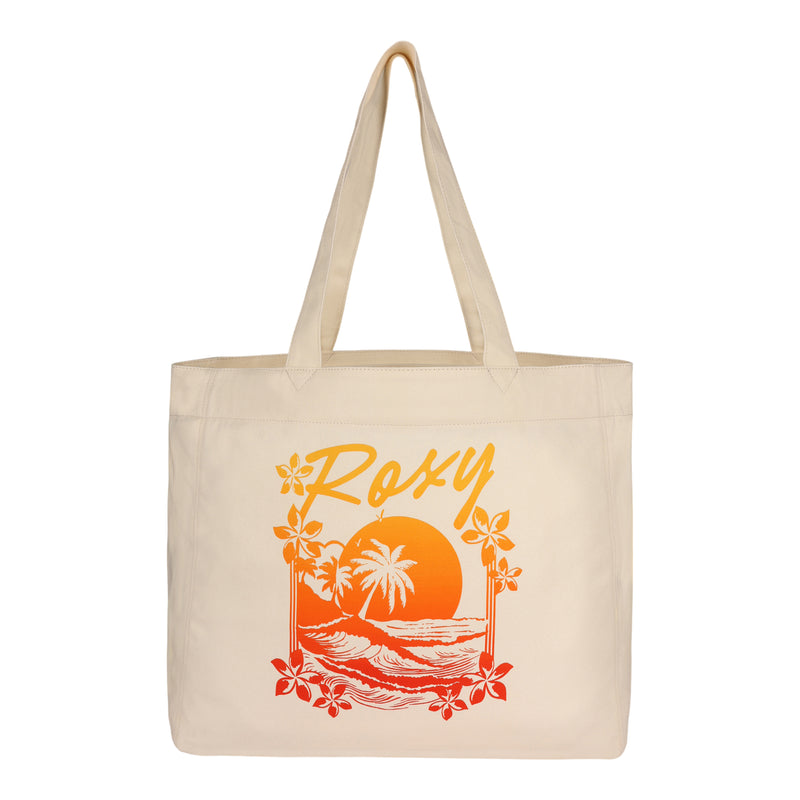 The ROXY Sunset Tote Bag is a beige canvas tote featuring the Roxy logo above a vibrant scene of orange and red sunsets, palm trees, ocean waves, and flowers.