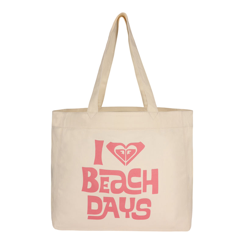 Carry your essentials in sustainable style with the ROXY Beach Days Tote Bag—a beige, eco-friendly canvas tote featuring two handles and “I love beach days” printed in pink with a heart graphic above the text.