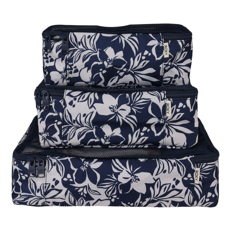 Three Oceanside-hued packing cubes from Roxy, each in a different size, are stacked together, showcasing their mesh panels and zippers—essential travel organizers made from durable, lightweight ripstop material.
