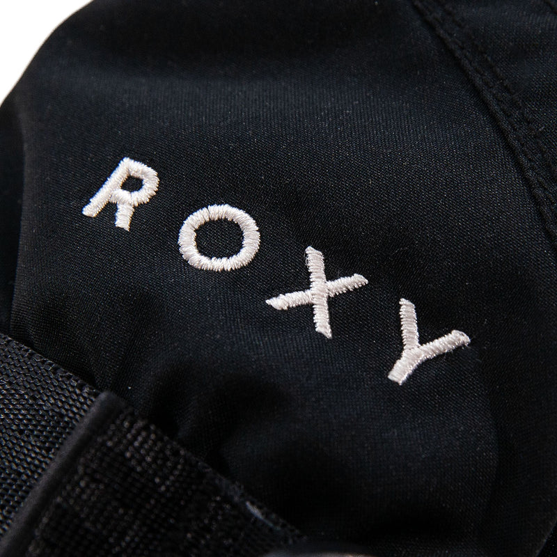 Close-up of black fabric with the word ROXY embroidered in white thread, featured on the Roxy Girls Jetty Girl Solid Mitts.