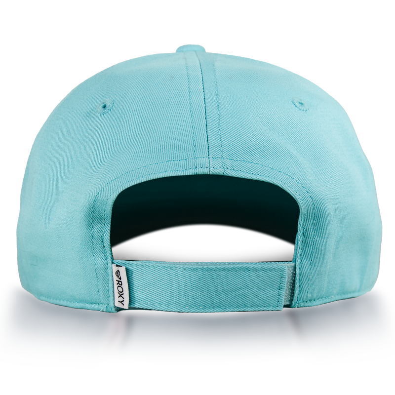 The Extra Innings Baseball Cap by Roxy, designed for women in light blue cotton twill, is shown from the back highlighting its adjustable strap with a small white ROXY tag. This cap features a curved visor and rests on a white surface with a subtle shadow underneath.