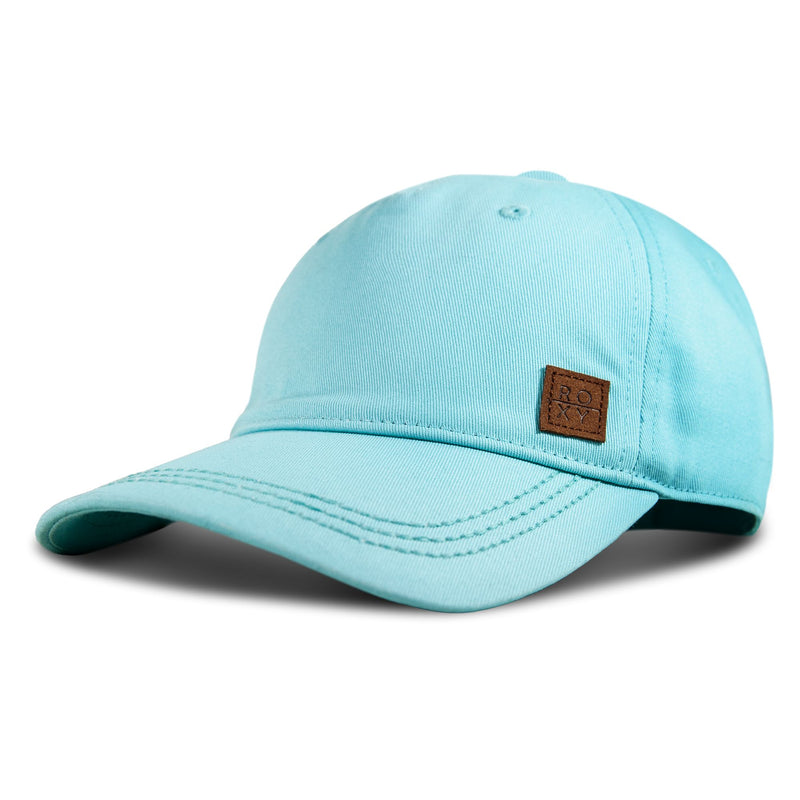 The Roxy Extra Innings Baseball Cap for women features a light blue cotton twill design with a curved visor and a small brown rectangular ROXY patch on the front. Displayed against a white background, the cap casts a subtle shadow.