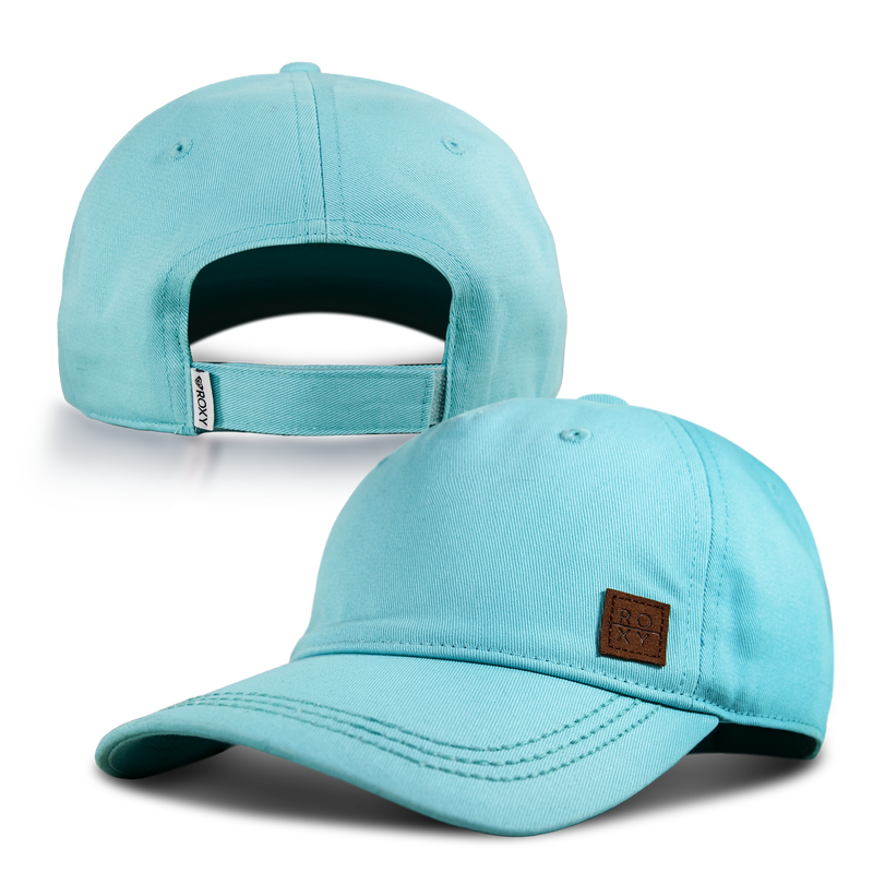 Two views of the Roxy Extra Innings Baseball Cap in light blue cotton twill for women: the front features a brown ROXY label, while the back highlights an adjustable strap with a small ROXY tag and a classic curved visor.