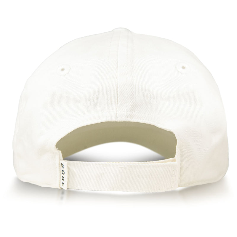 Back view of the Roxy Next Level Cap in white cotton twill, featuring a curved visor, adjustable strap with a small ROXY tag, and two stitched eyelets on each side for ventilation.
