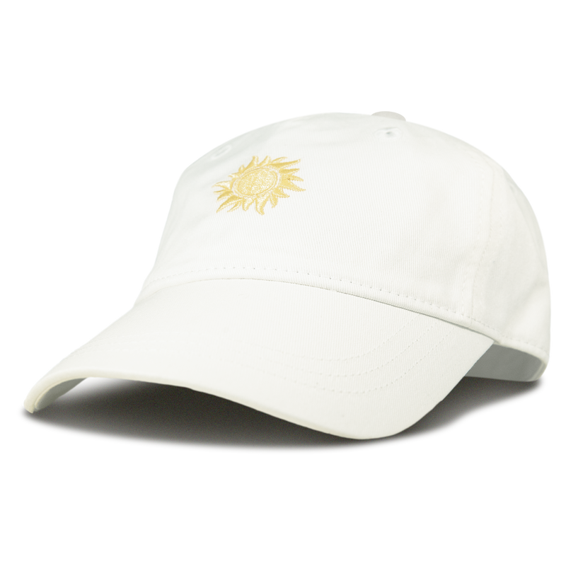 A Next Level Cap by Roxy in white, featuring a small yellow sun embroidered on the front, displayed on a plain white background.