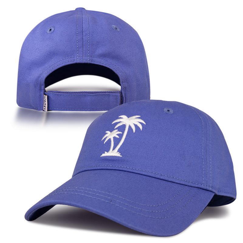 The Roxy Next Level Cap is a blue women’s baseball hat crafted from cotton twill, featuring a white embroidered palm tree on the front. Its curved visor offers a classic look, while the adjustable strap at the back includes a small white tag.