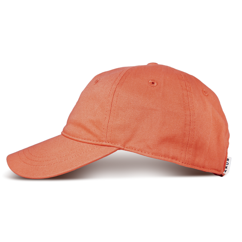 A side view of the Roxy Next Level Cap—an orange women’s baseball hat—appears against a plain white background. Made from soft cotton twill, this cap showcases a curved visor, visible stitching, and a small white tag at the back.