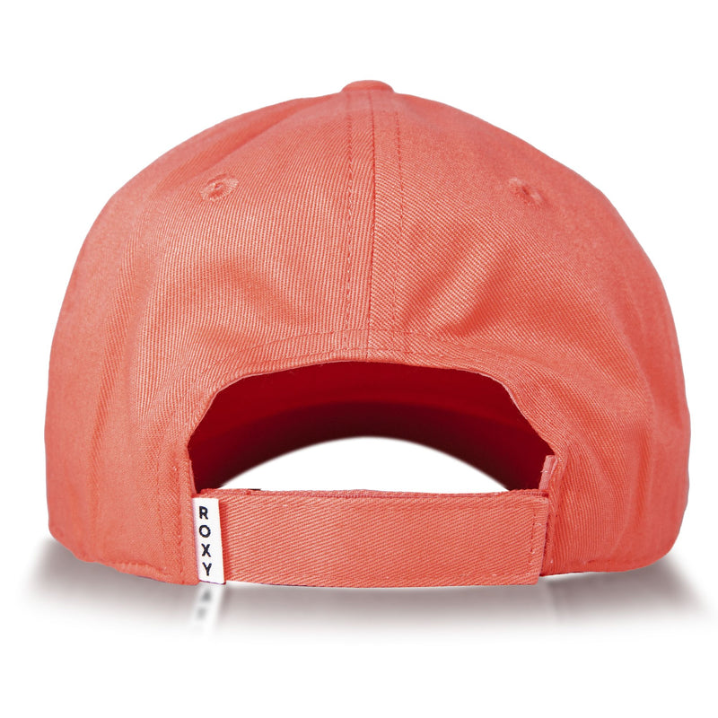 The back view of the Roxy Next Level Cap for women displays a coral pink cotton twill fabric with an adjustable strap and a curved visor, accented by a small white ROXY tag.
