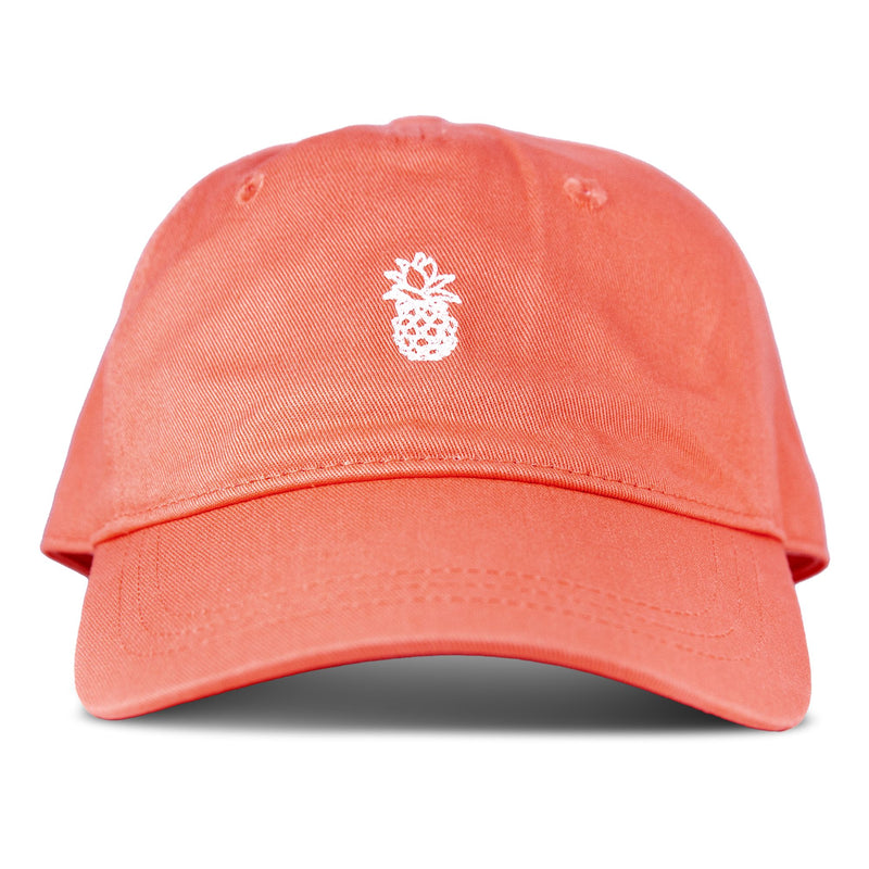 The Roxy Next Level Cap is a women’s baseball hat in papaya, crafted from soft cotton twill, featuring a small white embroidered pineapple on the front and a classic curved visor, shown against a white background.