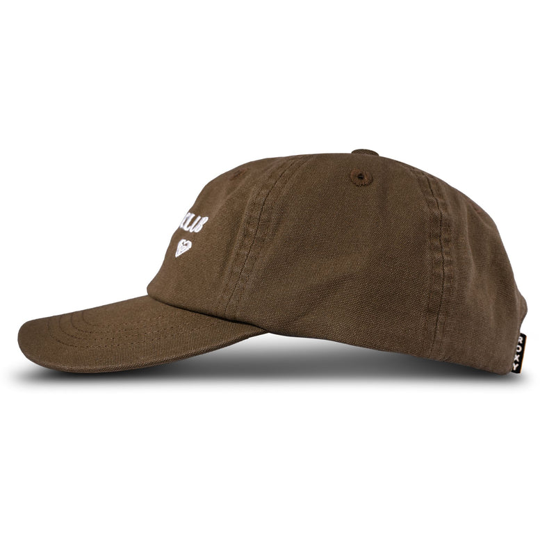 The Roxy Toadstool Cap features a brown design with a curved brim, shown from the side. White embroidered text and a small heart on the front add cool style, while a black Roxy brand tag accents the back.