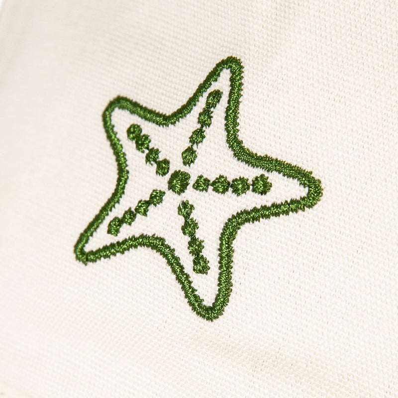 The Next Level Cap by Roxy features a whimsical green embroidered starfish outlined with dotted lines and dots, standing out beautifully against the crisp white cotton twill fabric. Designed for everyday comfort, this women’s baseball hat is finished with a curved visor.