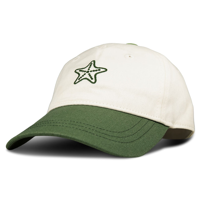 The Roxy Next Level Cap is a women’s baseball hat made from soft cotton twill, showcasing a white crown, green curved visor, and a bold green star embroidered on the front.