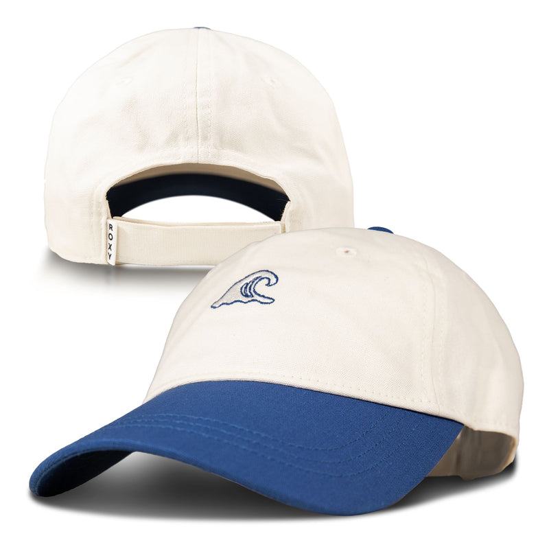 The Roxy Next Level Cap is a women’s baseball hat made from breathable cream cotton twill, featuring a blue curved visor and an embroidered wave logo on the front. An adjustable strap at the back ensures a comfortable fit.