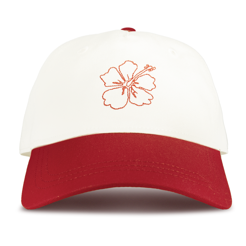 The Roxy Next Level Cap is a women’s baseball hat in Hibiscus/White, made from cotton twill with a red brim and curved visor, featuring an embroidered red hibiscus flower outline on the front.