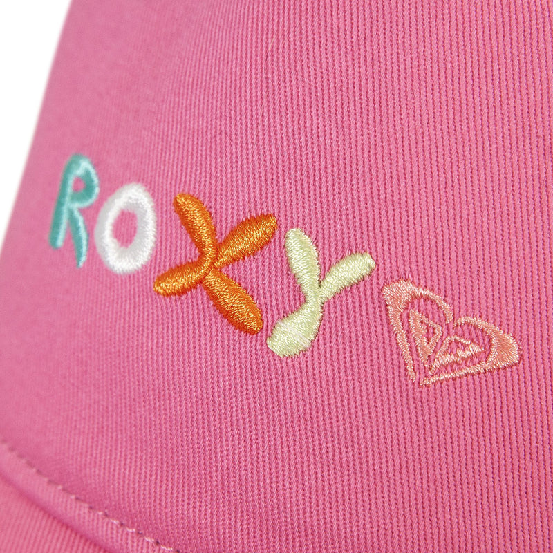 Close-up of pink fabric on the Roxy TW Next Level Baseball Cap, featuring the word ROXY embroidered in colorful thread and a stitched heart outline beside the text—making this cap a versatile accessory and everyday essential.
