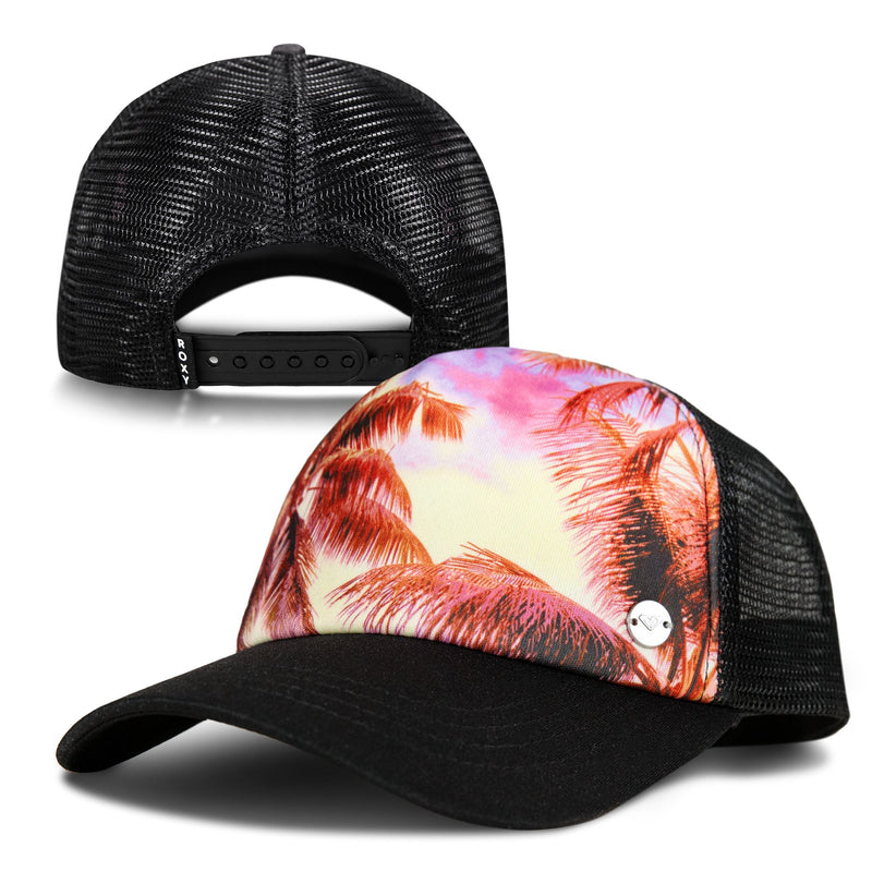 The ROXY Pro Surf Trucker hat features a black mesh design with a front panel showcasing a vibrant pink and orange palm tree sunset, perfect for beach vibes. One side displays the colorful artwork, while the other view highlights its adjustable snapback closure.