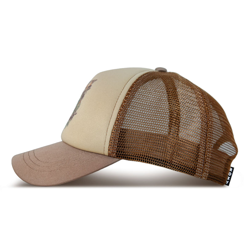 The Roxy Sandy Top Trucker cap, shown in a side profile on a white background, features beige and brown coloring with a solid front panel, breathable mesh back, and a curved brim. Its adjustable snapback ensures a comfortable fit, making it perfect for sun protection during outdoor adventures.