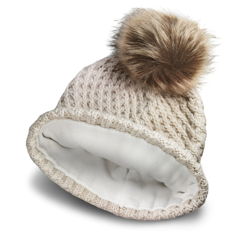 Beige chunky knit Roxy Blizzard Beanie with a faux fur pompom and a white fleece lining.