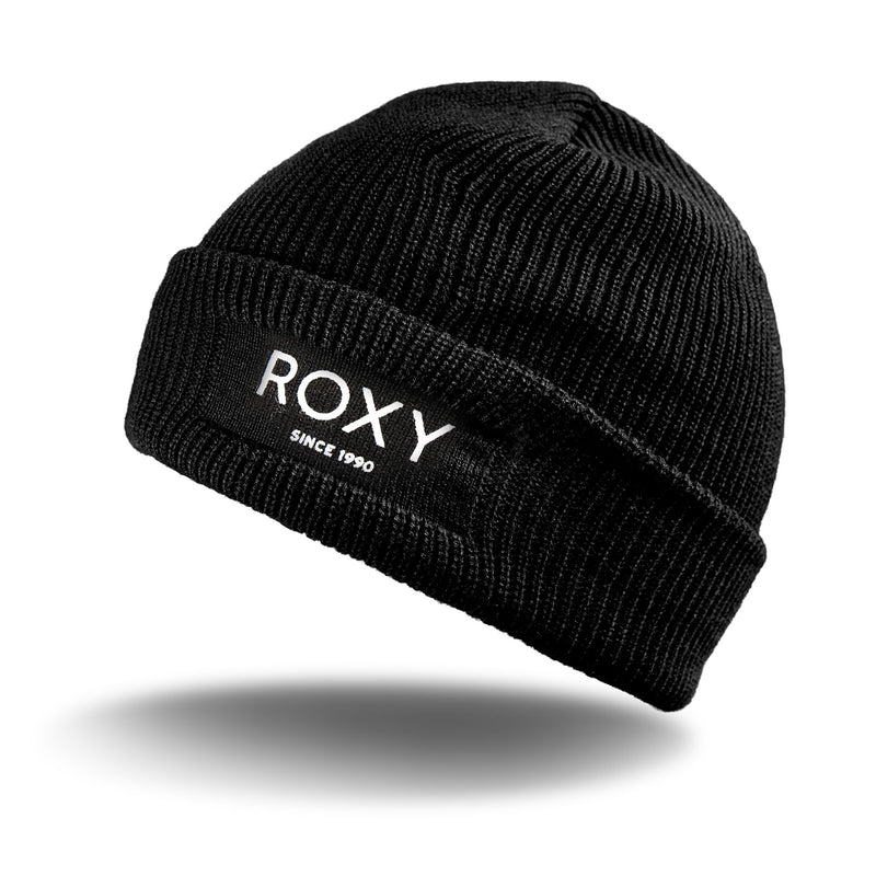 The Roxy Blizzard Beanie, a black chunky knit hat featuring “ROXY SINCE 1990” embroidered in white on the front cuff, is displayed against a white background with a subtle shadow beneath it.