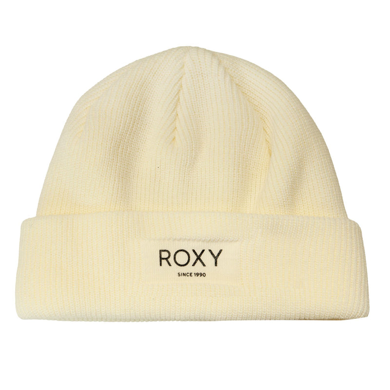 The Roxy Blizzard Beanie is a cream-colored chunky knit winter hat with a folded brim and a fleece lining for extra warmth. Featuring a front patch that reads “ROXY SINCE 1990” in black lettering, this cozy beanie combines style and comfort for cold-weather days.