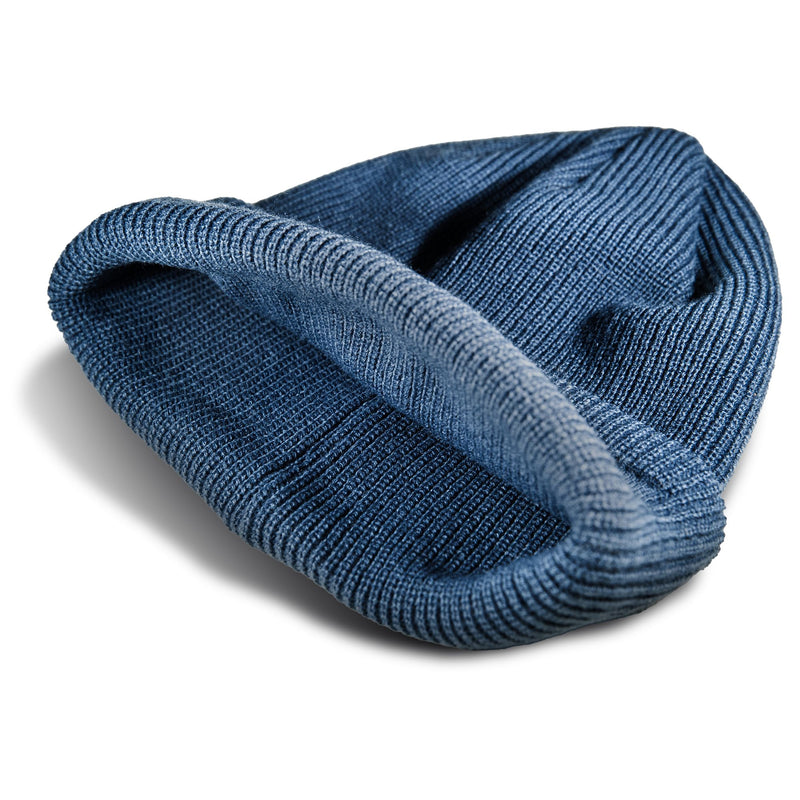 A folded blue Roxy Folker Beanie in rib knit.