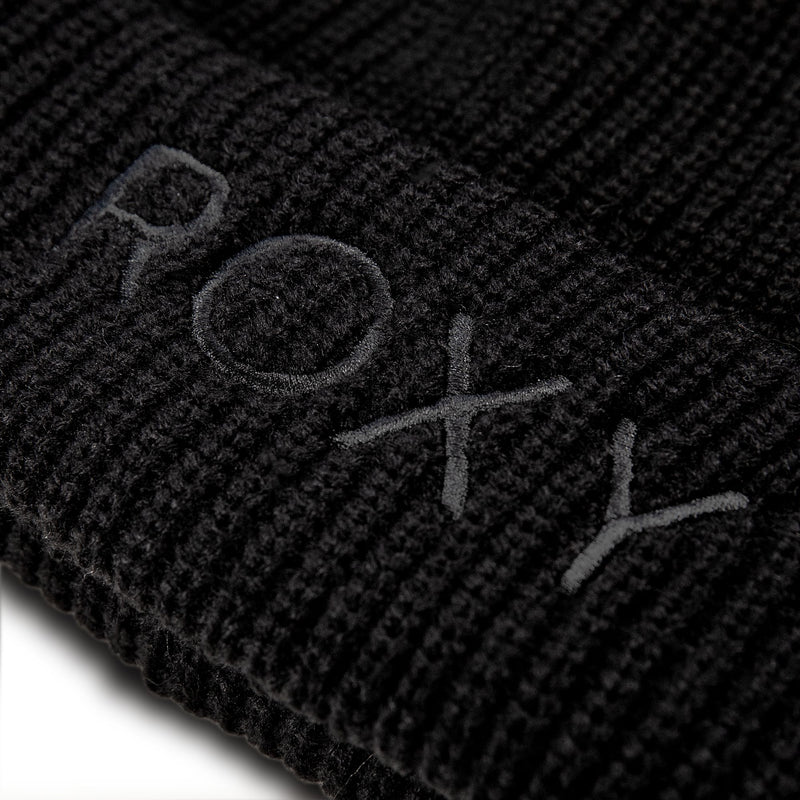 Close-up of a black Roxy Freja Beanie in a rib knit, featuring the brand name embroidered in matching thread.