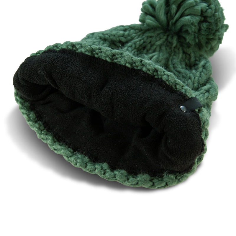 The Roxy Winter Beanie is a green chunky knit hat featuring a playful pom-pom on top, shown inside out to reveal its soft black fleece lining. This stylish women’s accessory is designed to keep you warm and cozy on chilly days.